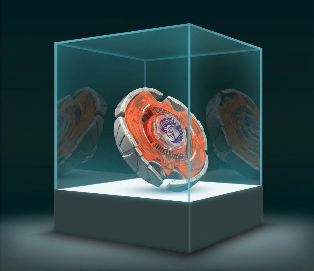 Loose orange and silver Beyblade floating in a glass display case